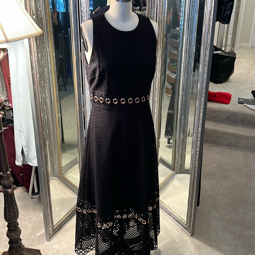 Gianni Bini  black eyelet overlay dress with Gromit detailing at waste and hem